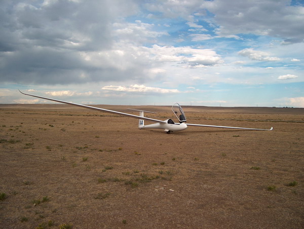 Final glide from clouds over the horizon